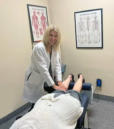 Dr. Lori Christian providing hands-on chiropractic care