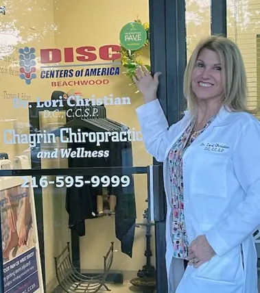 Dr. Lori Christian standing at the clinic entrance